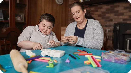 Brantley doing an arts and crafts activity with his mother