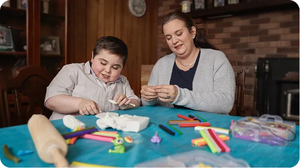 Brantley doing an arts and crafts activity with his mother