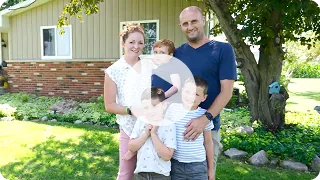 Video thumbnail: Emmett and his family standing together outdoors. Watch Emmett's story.