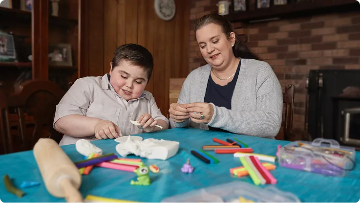 Brantley doing an arts and crafts activity with his mother