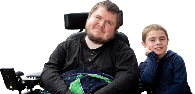 Triston and Nicholas, both living with Duchenne, smiling together